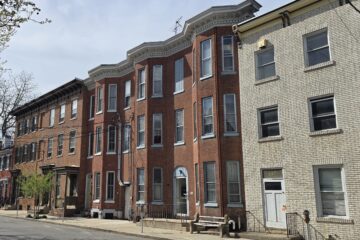 a carlisle, pa streetscape of a row of brick houses town houses in 17013