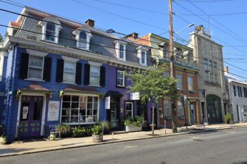 residential homes streetscape in carlisle, pa on W Pomfret Street on a sunny blue sky August 2026 summer day