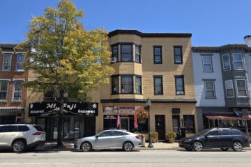 a commercial with residential on top streetscape on north hanover street in carlisle pennsylvania with blue sky in August 2026