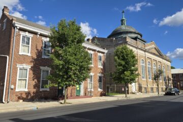 Carlisle Christian Academy from S West St side in September 2026 on bright sunny day with blue sky
