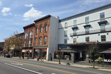 commercial streetscape on s hanover st in carlisle pa with blue sky and white fluffy clouds